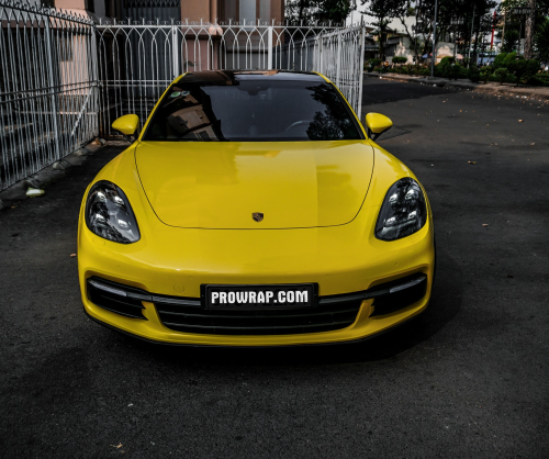 wrap xe, dán đổi màu xe Porsche Panamera wrap gloss yellow