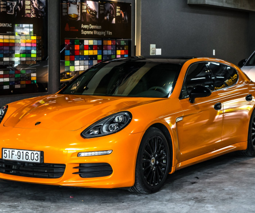 wrap xe, dán đổi màu xe Porsche Panamera wrap gloss Orange