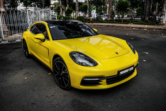 wrap xe, dán đổi màu xe Porsche Panamera wrap gloss yellow